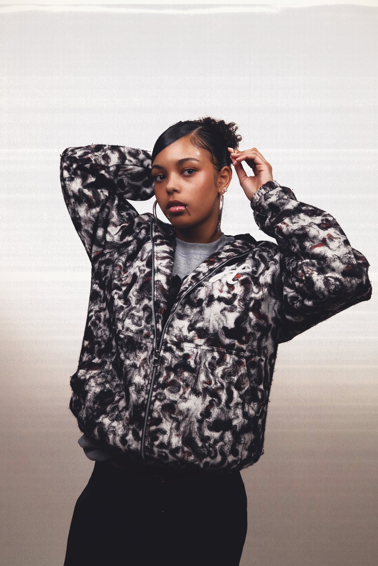 veste zipé a capuche avec doublure matelassé.